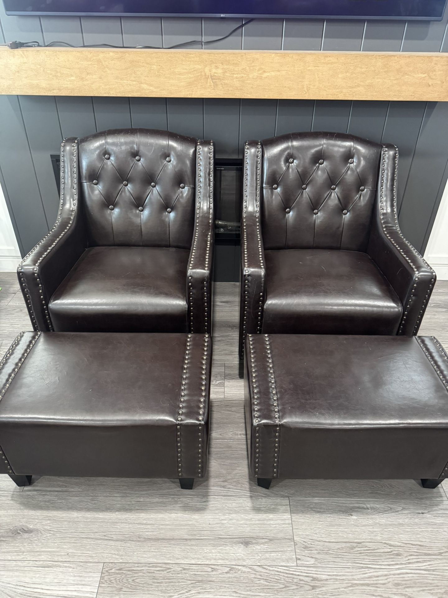 2 Leather Chairs w/ Ottomans