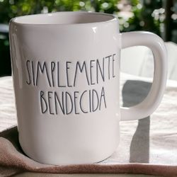 Rae dunn Simplemente bendecida mug.
New without tag. bottom has some scuffing .
