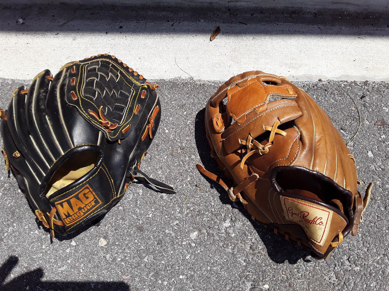 All leather baseball gloves one left one right