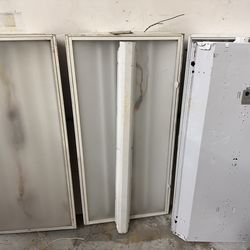 4 2’x4’ fluorescent light fixtures with instant start ballast and bulbs