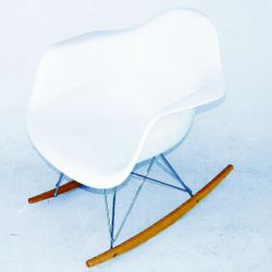 One  Eames Design Plastic Lounge Rocking Chairs