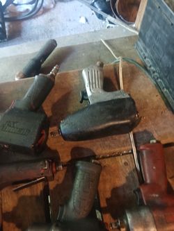 Assortment of air tools with hoses