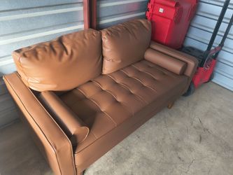 Brown faux leather sofa