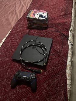 PlayStation 4 with controller and 10 games