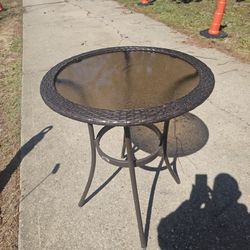 The price is firm.. beautiful basket weave outdoor patio small table