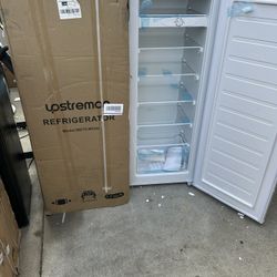 Brand new apartment/dorm refrigerator with top freezer