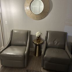 2 gray swivel chairs