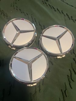 3 Mercedes Benz rim caps for $21.00