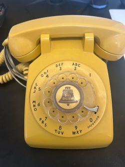 Vintage bell systems rotary phone yellow