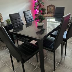 Black dinning table and six chairs