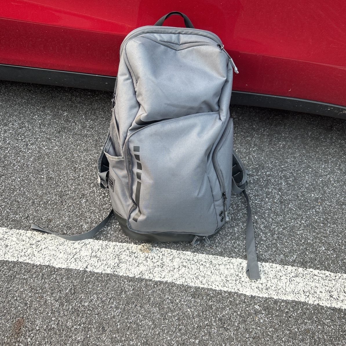 gray nike elite backpack Varsity DTLR with a spacious main compartment and zippered pockets ideal for your small essentials Nike Varsity Elite Printed Backpack