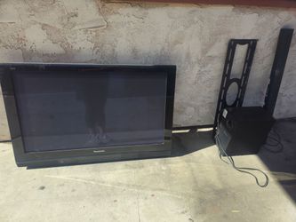 TV with wall mount and Soundbar