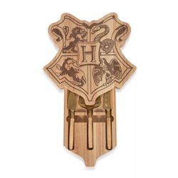 Toscana Harry Potter Hogwarts Crest charcuterie board set features a parawood construction and a concealed drawer holding three stainless steel cheese