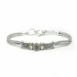 .925 sterling silver and 18kt Garnet oval bracelet.