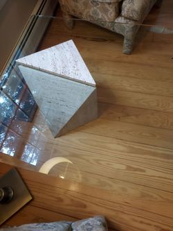 Glass top table with stone base