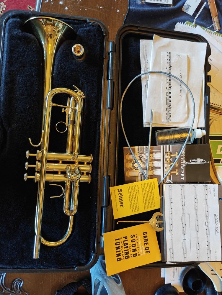 Bach Trumpet With Locking Hard Case, Mouthpiece, Music Stand, and all Accessories.