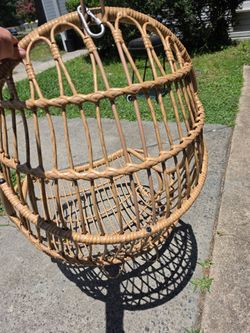 Hanging wicker egg chair with the cusion