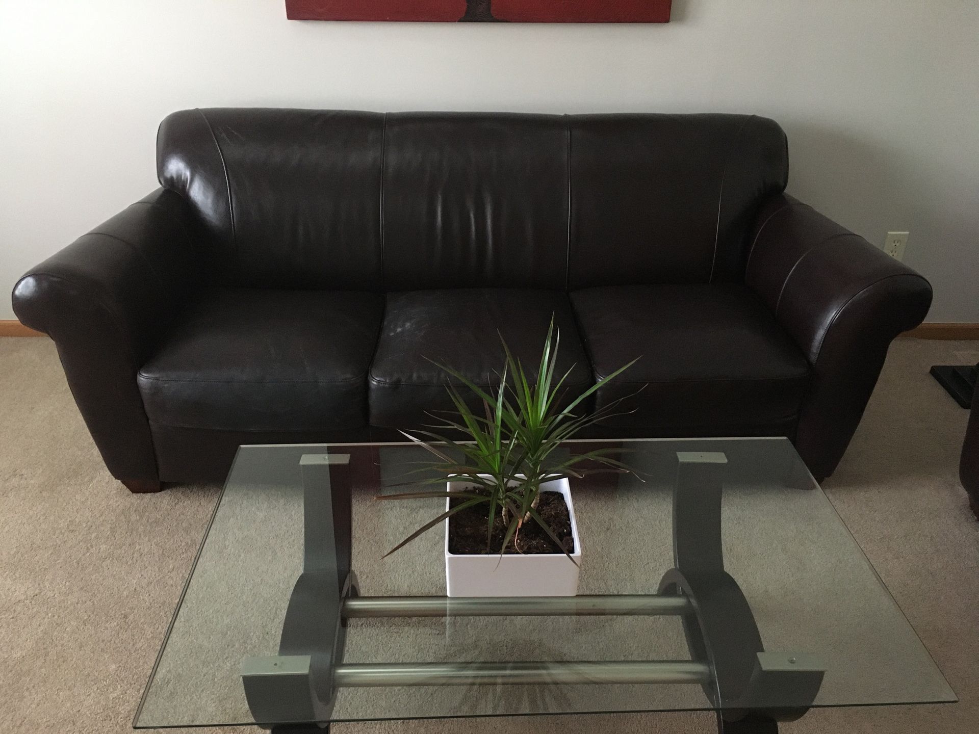 Dark brown leather sofa and love seat