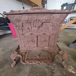 1855
This item is an antique cast iron parlor stove, featuring ornate decorative
Obo