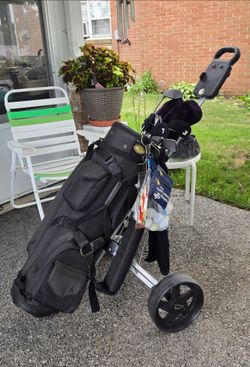 Solf bag with balls, club and bag cart