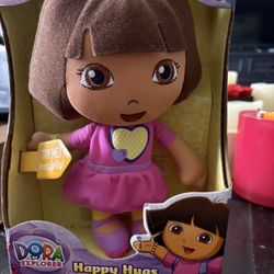 Fisher-Price Happy Hugs Dora plush doll from the Nickelodeon series Dora the Explorer. 