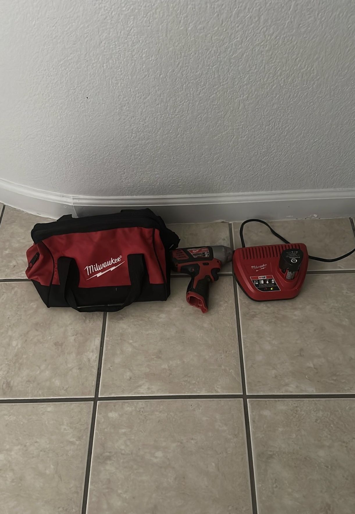 Milwaukee 1/4" Hex Impact Driver 12V Battery And Charger Included & Tool Bag $80