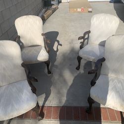 Four beautifully designed eagle head dinette chairs.