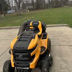 Riding lawn mover snow blower water dispenser