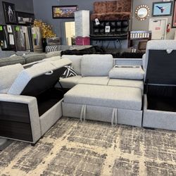 Beautiful Sectional With Pull Out Bed And Cup Holders 