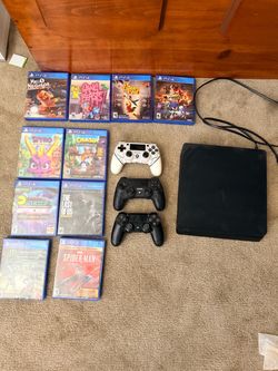 PS4 with games and controllers