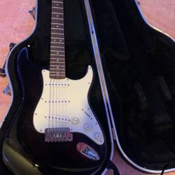 Guitar, Electric Black And White Squier Stratocaster