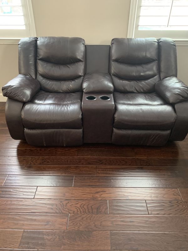 Brown color 2 seat Ashley leather sofa recliner with cup holder for Sale in Dublin, CA - OfferUp