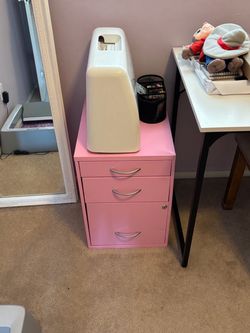 Pink metal filing cabinet