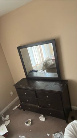 Dresser with mirror attached
