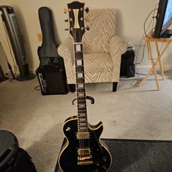 LES PAUL GIBSON (NOT SURE OF REAL TITAL. JUST A GUESS)
