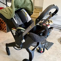 Doona Infant Car Seat + Base + Seat Cover – $300 (Excellent Condition)