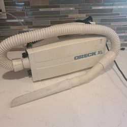 Oreck XL handheld vacuum with attachments and bags