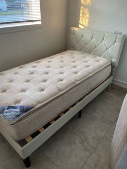Airsprung twin mattress and tufted headboard and frame