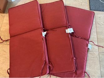 Three high back outdoor chair cushions