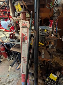 Two upright heavy duty floor jacks & pry bar