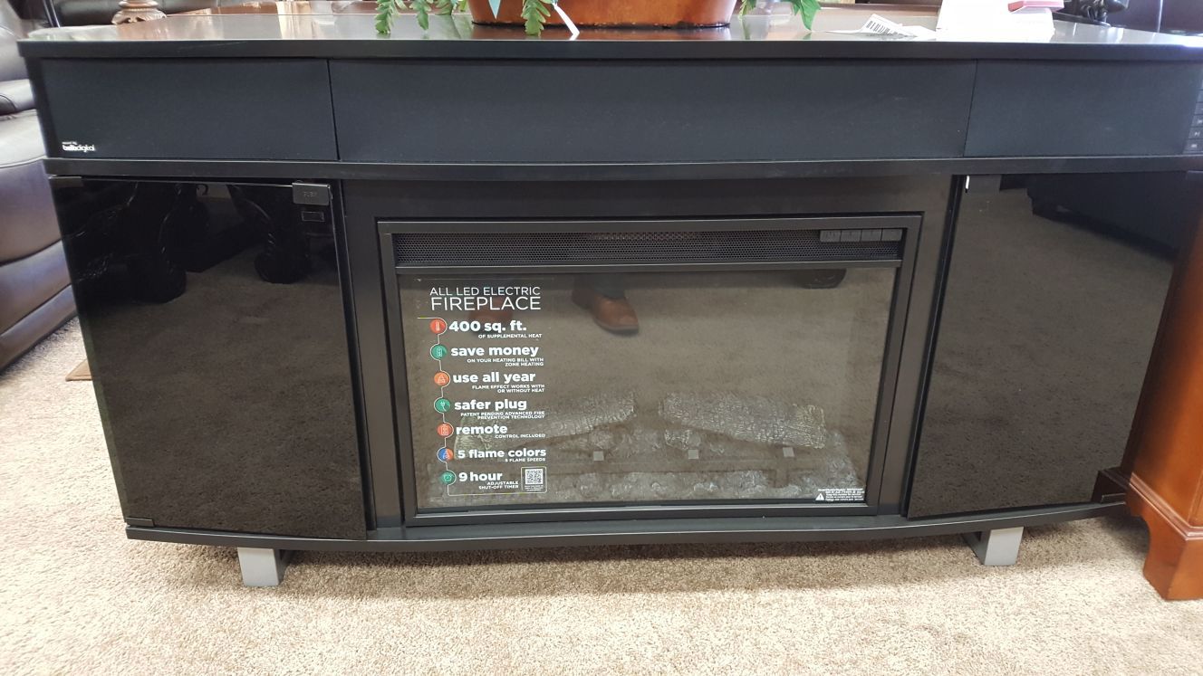 Sound bar 56 tv stand with fire place really nice