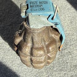 replica or practice pineapple-style hand grenade fitted with an M228 fuze
