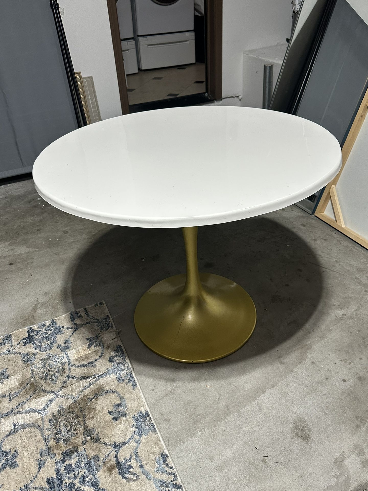 white table with gold stand