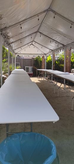 Carpa blanca 10x40 mesas sillas manteles