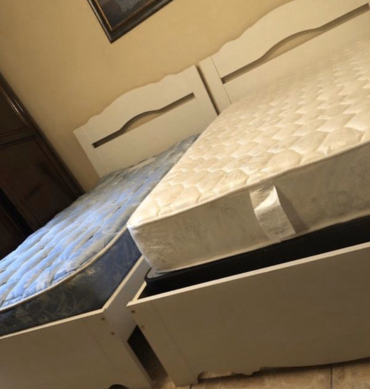 2 complete Twin bed frames and headboards, along with mattresses and box springs one nightstand all excellent condition