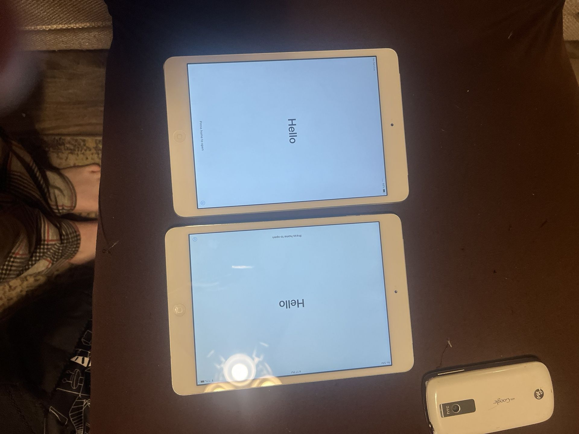 Two Ipad Minis, iPad Mini 4 Left, And iPad Mini 3 Right.