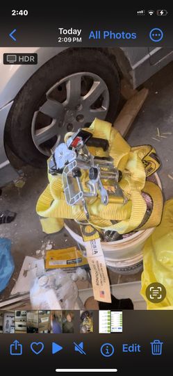 Bucket full of ratchet straps , tie downs , hooks