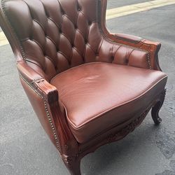Vintage Rococo Design carved wood and leather armchair