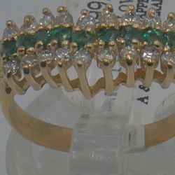 14kt yellow gold V shaped ring 2.9 grams; w 18 round  diamonds approximately  0.33pts ;9 round  emeralds ; size 6.25. 858723-2.