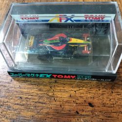 Tomy Super Magna EX 1/43 scale die-cast model of the Espo Larrousse LC90 Formula 1 car